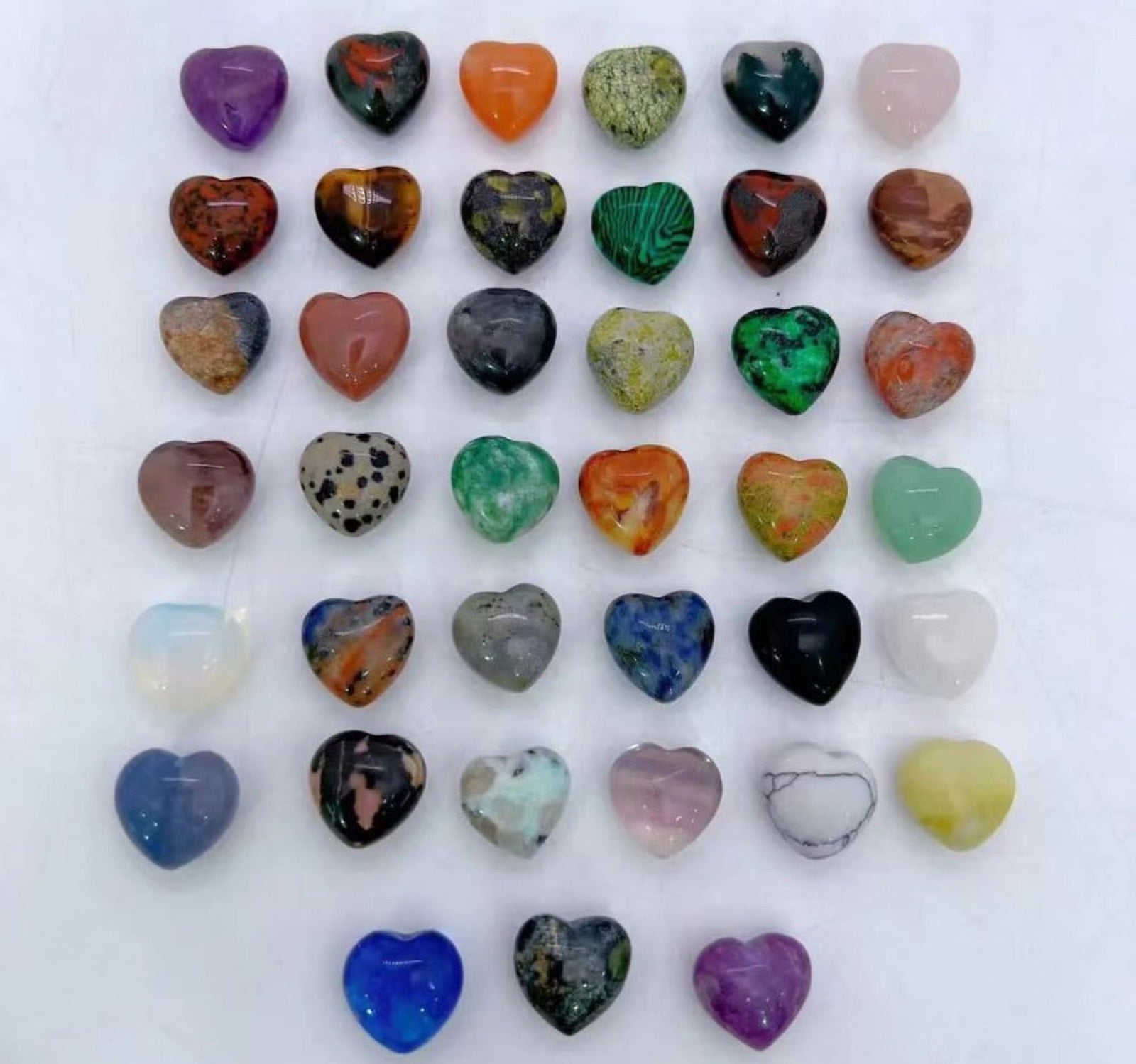 Mixed crystal heart carvings arranged in rows