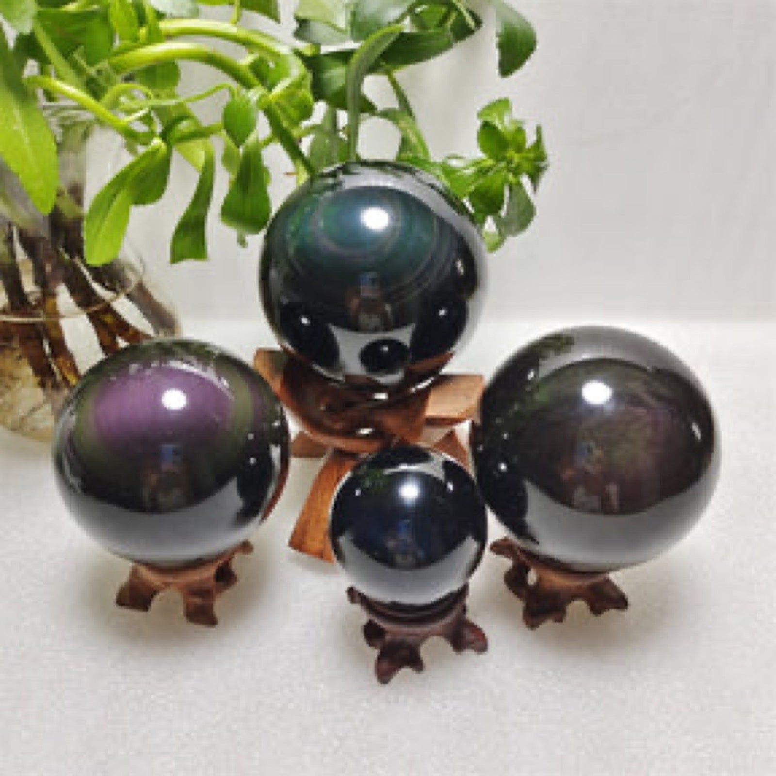 Polished crystal spheres arranged on wooden stands